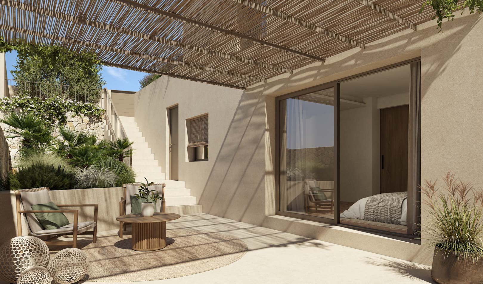 Außen-Terrasse mit Schilfrohr-Pergola, Lounge-Möbeln aus Holz und direktem Zugang zum Schlafzimmer durch große Glasschiebetüren.
