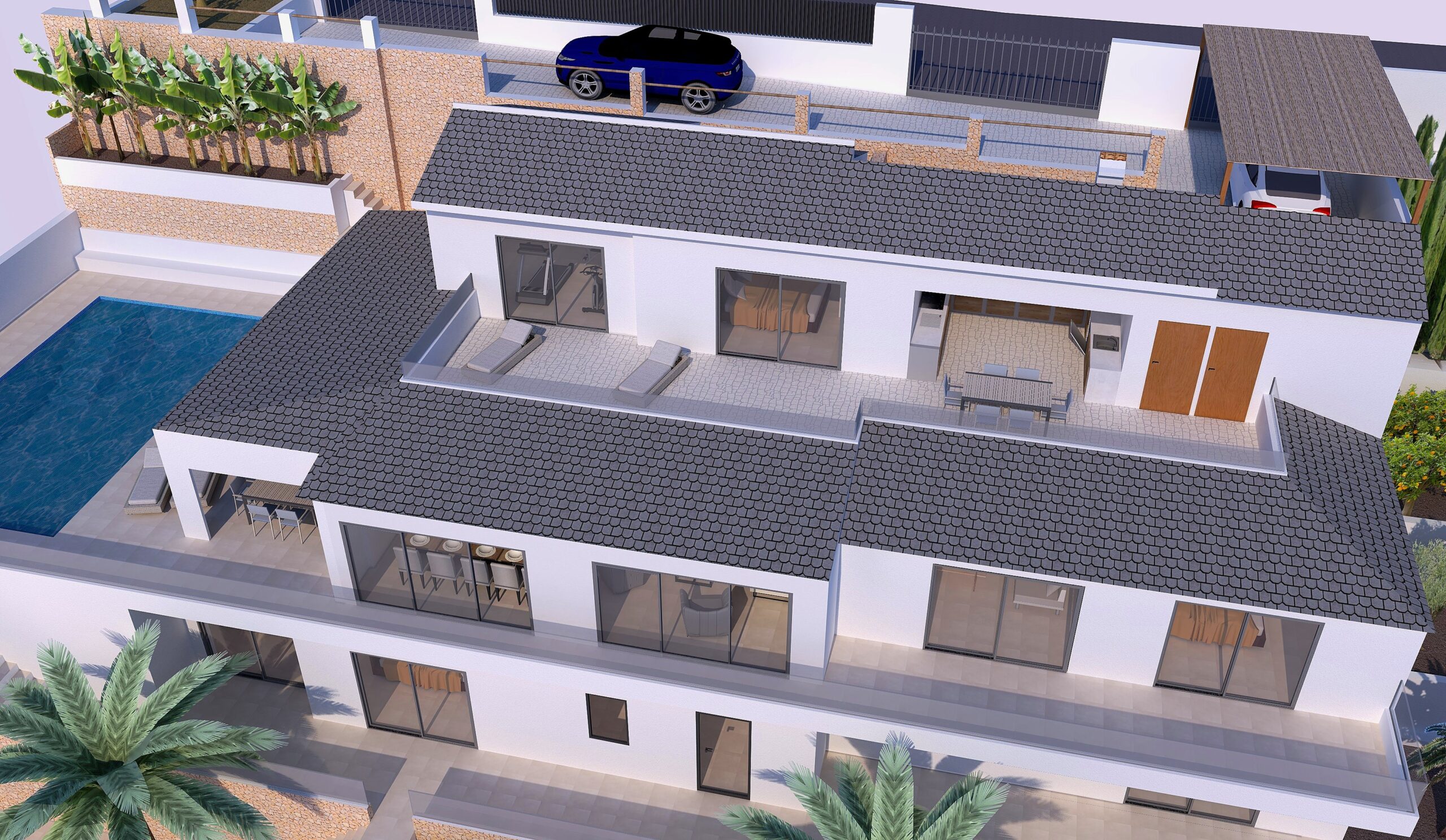 Luftaufnahme der renovierten Villa mit abgestufter Architektur, grauen Ziegeldächern, weitläufigen Terrassen mit Glasgeländern und seitlichem Poolbereich.
