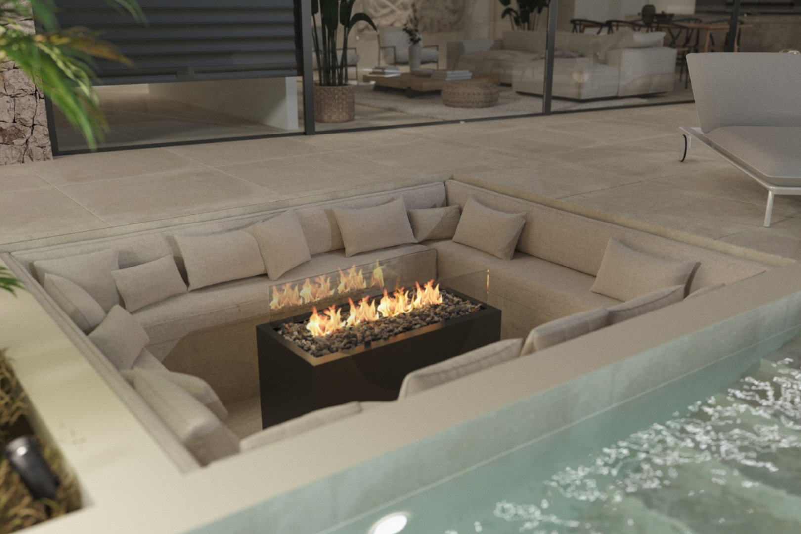 Abgesenkter Loungebereich im Freien mit eingebauten Sitzbänken und zentraler Feuerstelle, direkt neben dem Pool auf der Terrasse.