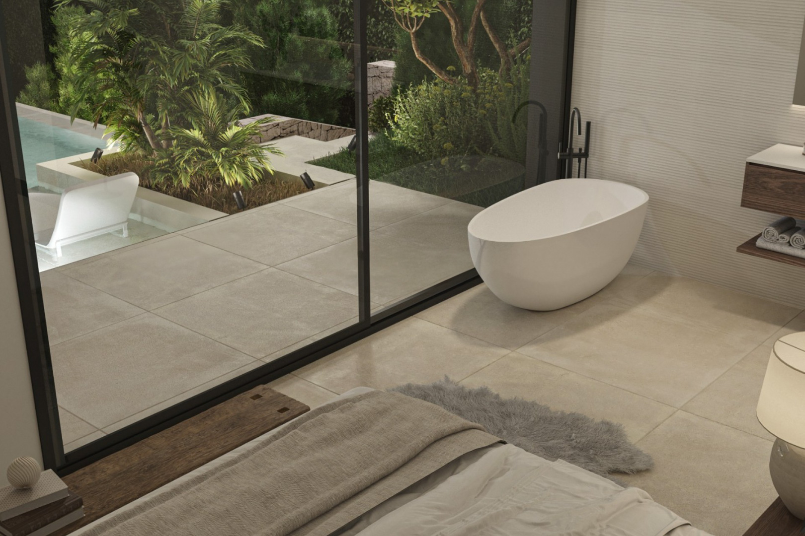Hauptschlafzimmer mit freistehender Designer-Badewanne und bodentiefen Glasfronten, die auf die private Terrasse mit Gartenblick führen.
