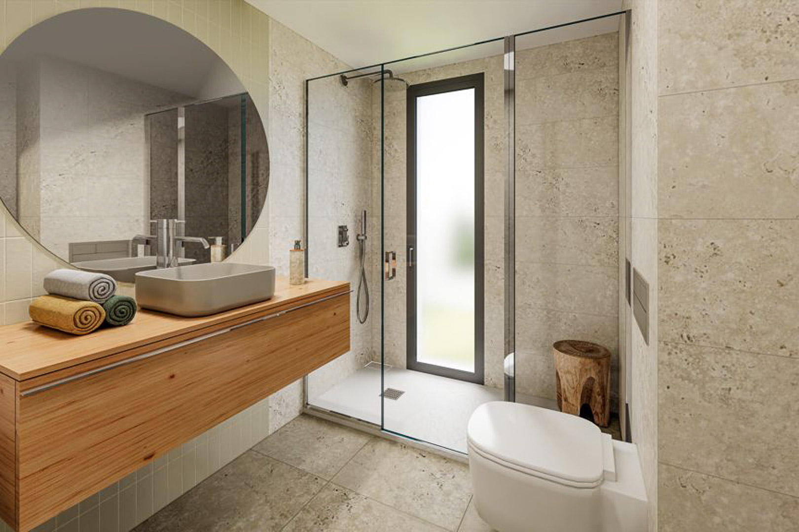 Modernes Badezimmer mit schwebendem Holzwaschtisch, Aufsatzwaschbecken und rundem Spiegel. Begehbare Dusche mit Glastrennwand und Fliesen in eleganter Natursteinoptik.