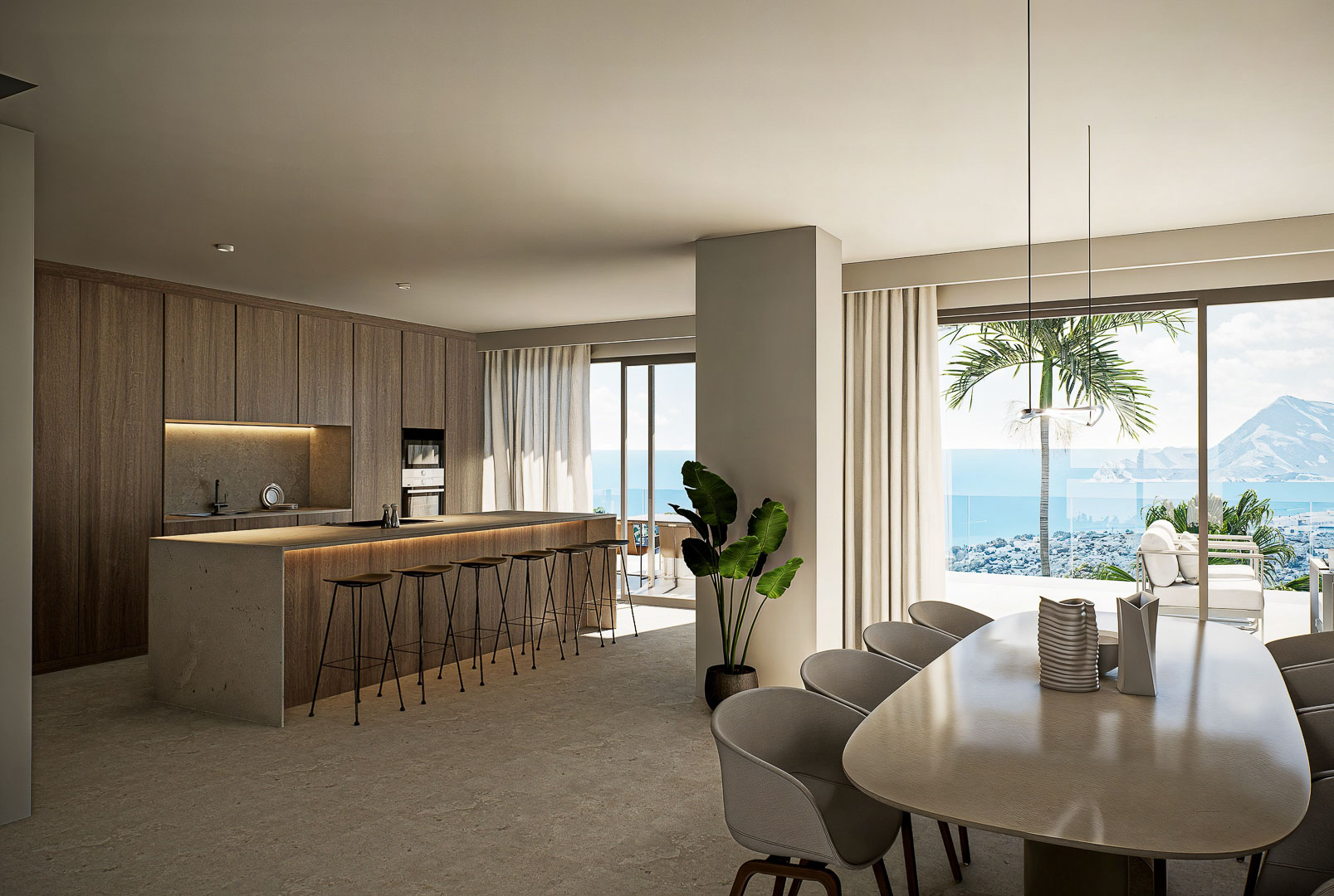 Designerküche mit Steininsel und integriertem Essbereich, bodentiefen Fenstern und Panoramablick auf das Mittelmeer und die Küste.