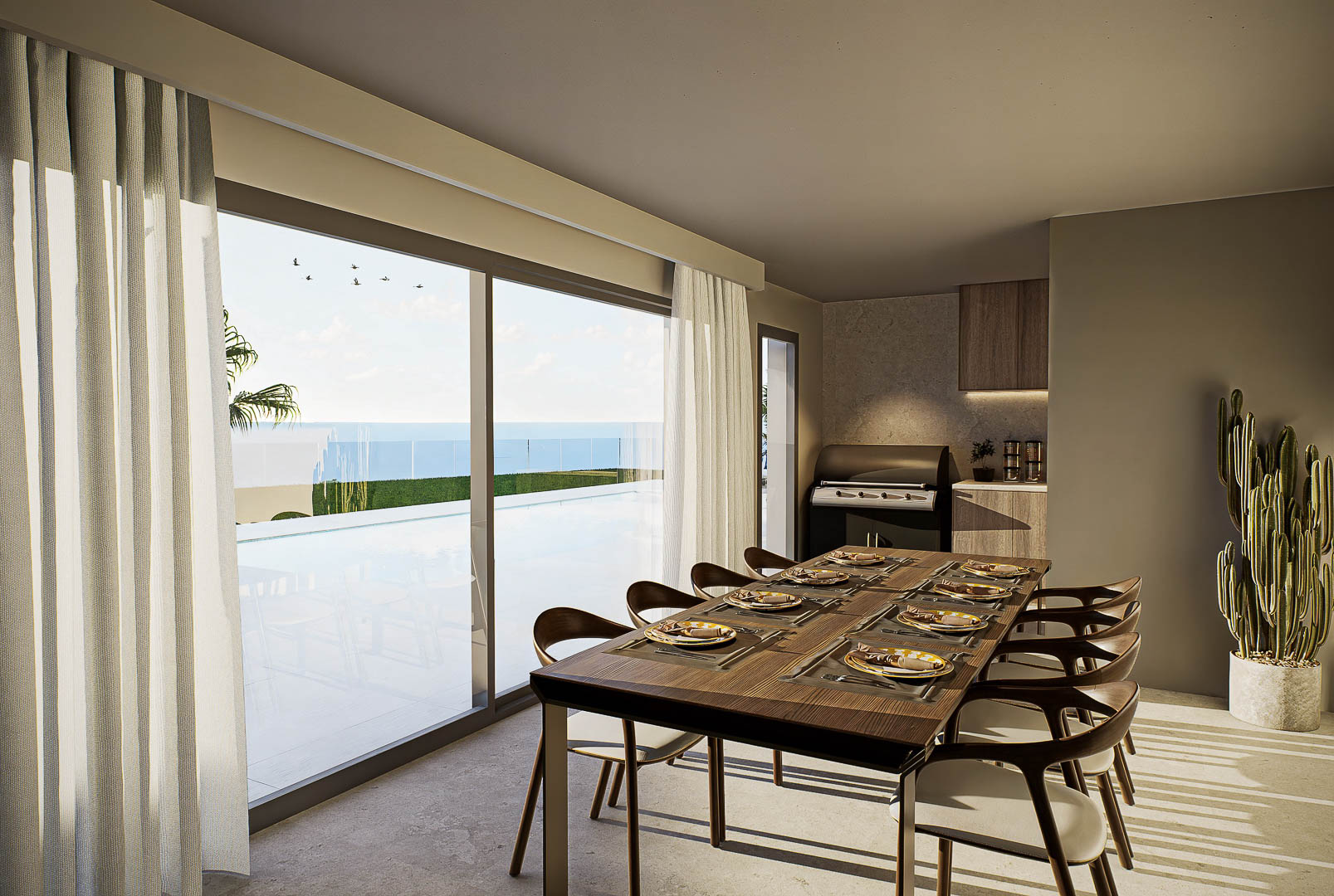 Eleganter Essbereich mit Massivholztisch und Designerstühlen, der durch große Glasfronten einen direkten Zugang zum Pool und Panoramablick auf das Meer bietet.