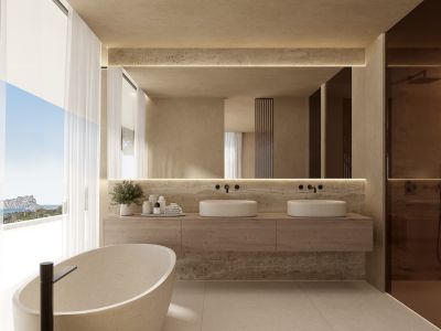 Hauptbadezimmer mit freistehender Steinbadewanne, Doppelwaschbecken und Panoramameerblick durch große Fenster.