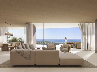 Offener Wohn- und Essbereich mit modularem Sofa, raumhohen Fenstern und Meerblick, ergänzt durch einen Esstisch aus Holz.