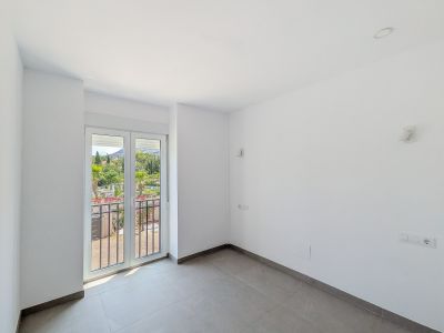 Schlafzimmer mit Balkonzugang