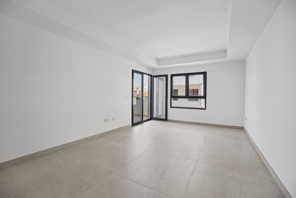Wohnzimmer mit Zugang zur Terrasse