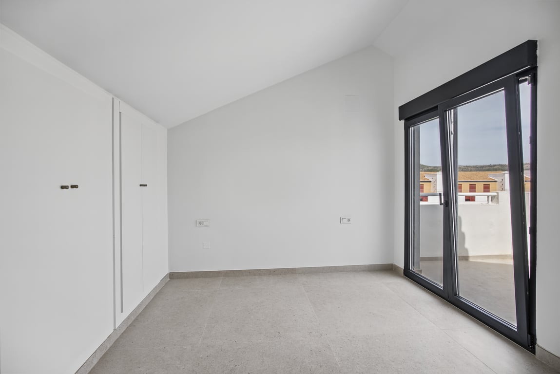 Schlafzimmer mit Zugang zur Terrasse