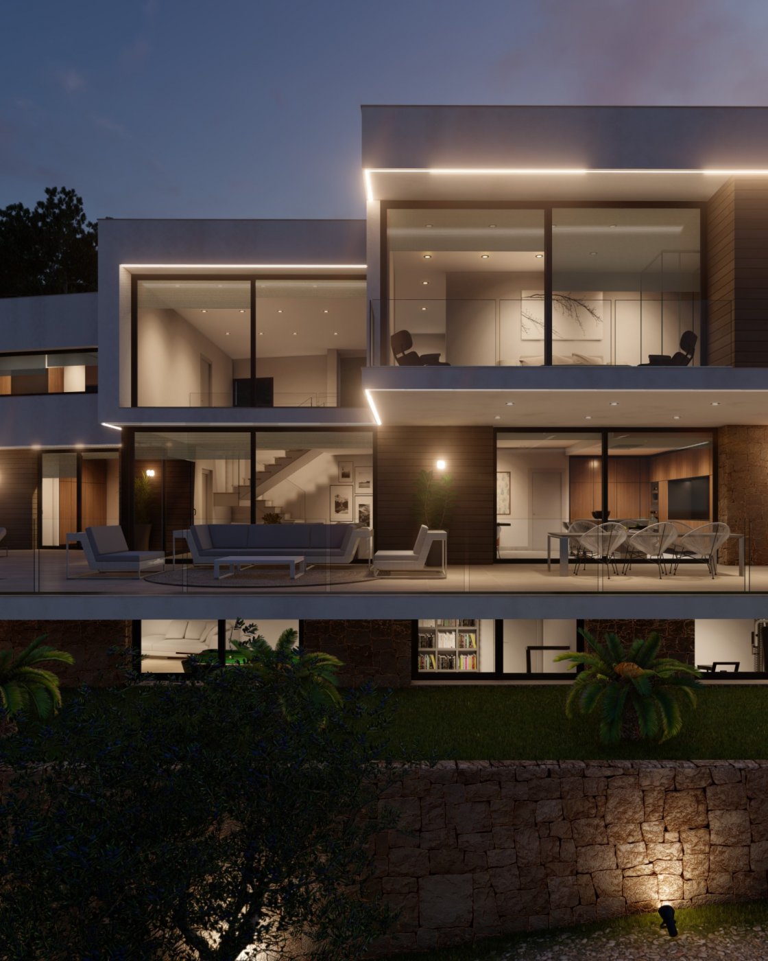 Moderne Villenfassade bei Dämmerung mit bodentiefen Glasfronten, linearer LED-Beleuchtung, Terrasse mit Loungemöbeln und einer Natursteinmauer.