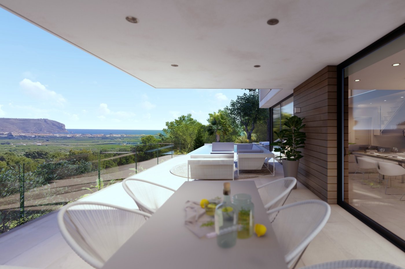 Überdachte Terrasse mit Essbereich im Freien, Lounge-Möbeln, Glasgeländern und Panoramablick auf das Tal und die Mittelmeerküste.
