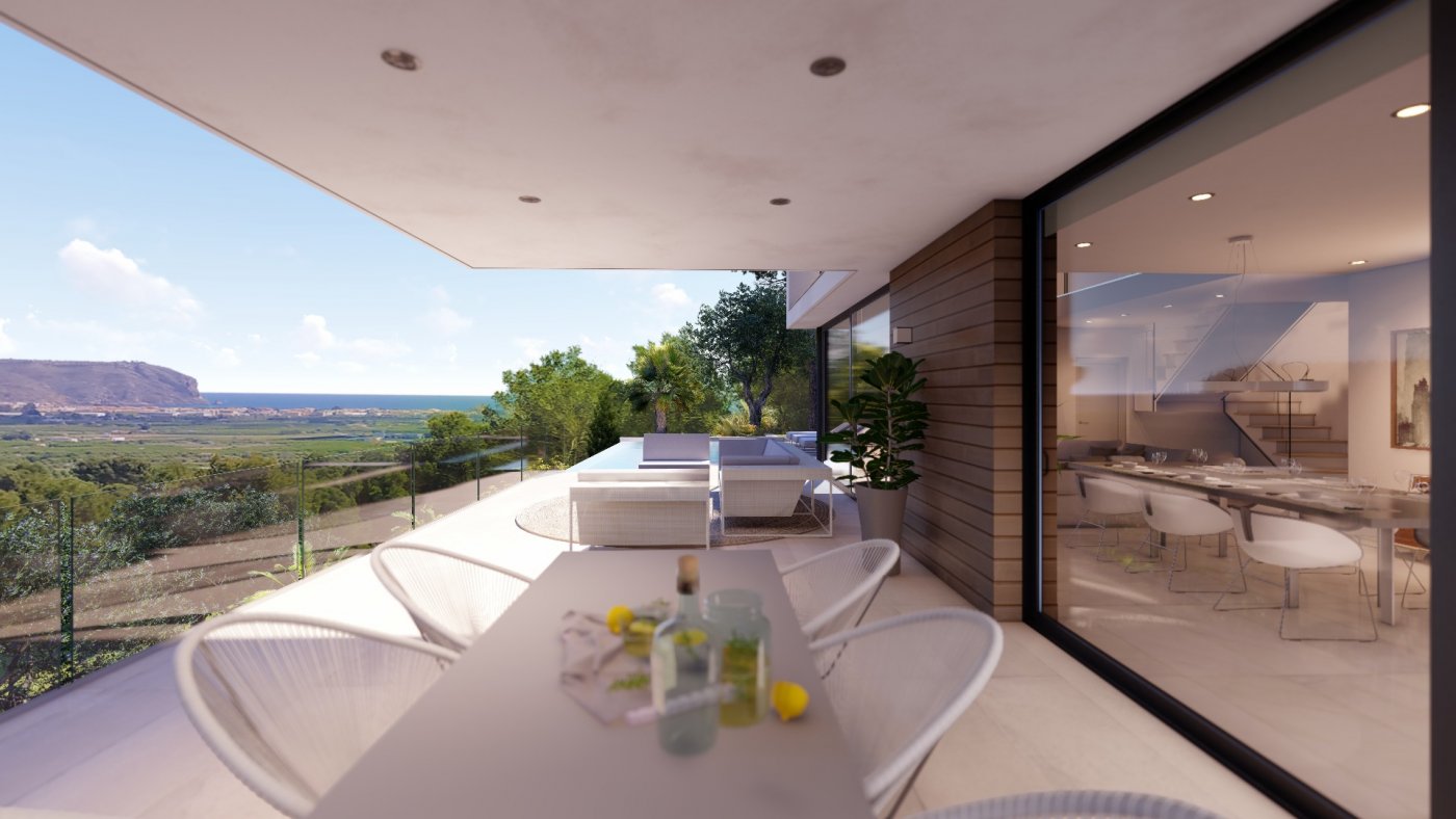 Überdachte Terrasse mit Essplatz und Lounge-Bereich, Glasgeländer und Panoramablick auf das Tal sowie direktem Zugang zum Innenbereich.