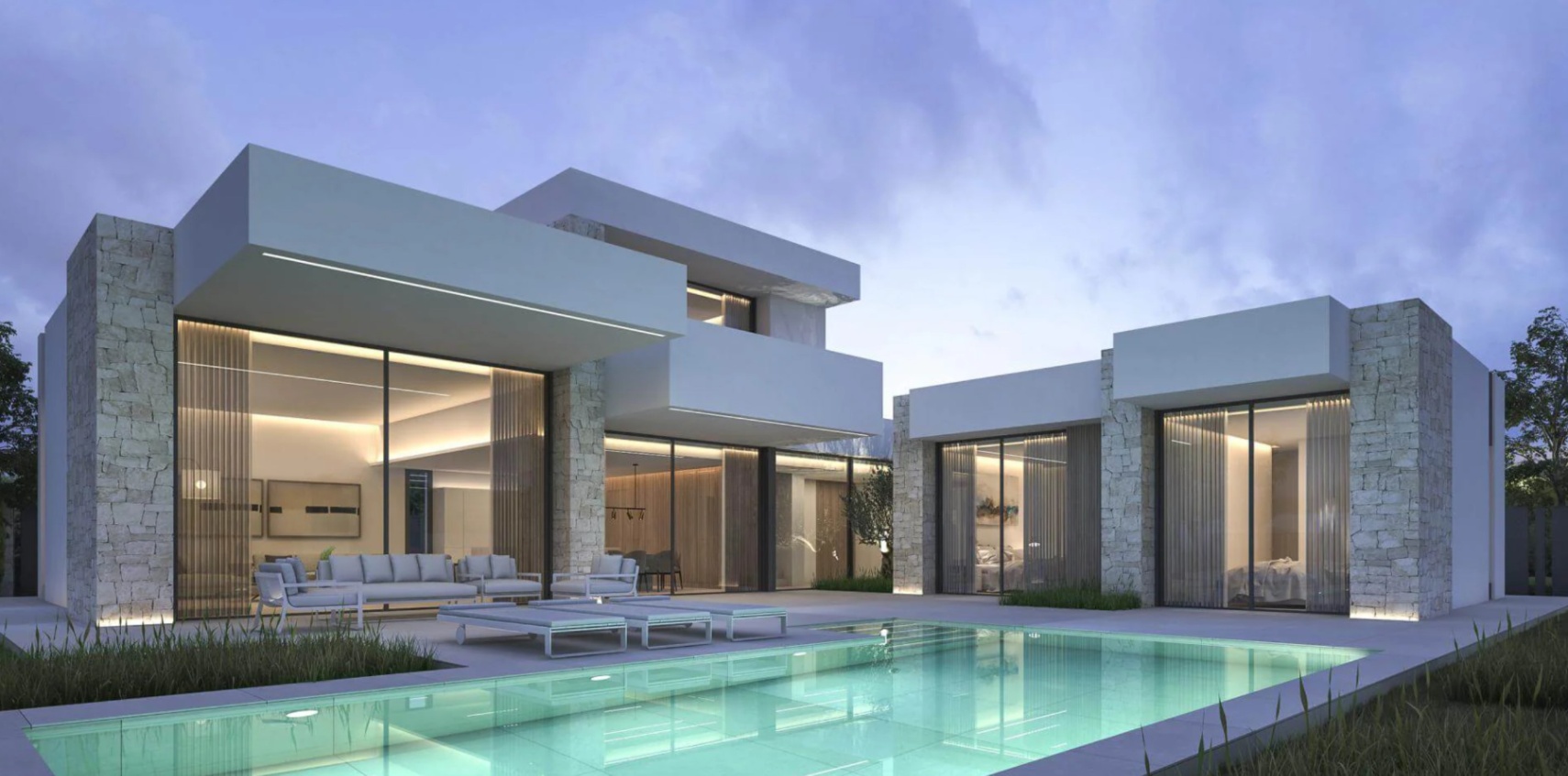 Moderne Villa bei Dämmerung mit türkisfarbenem Pool, Natursteinwänden und großen Glasfronten, die den Loungebereich beleuchten.