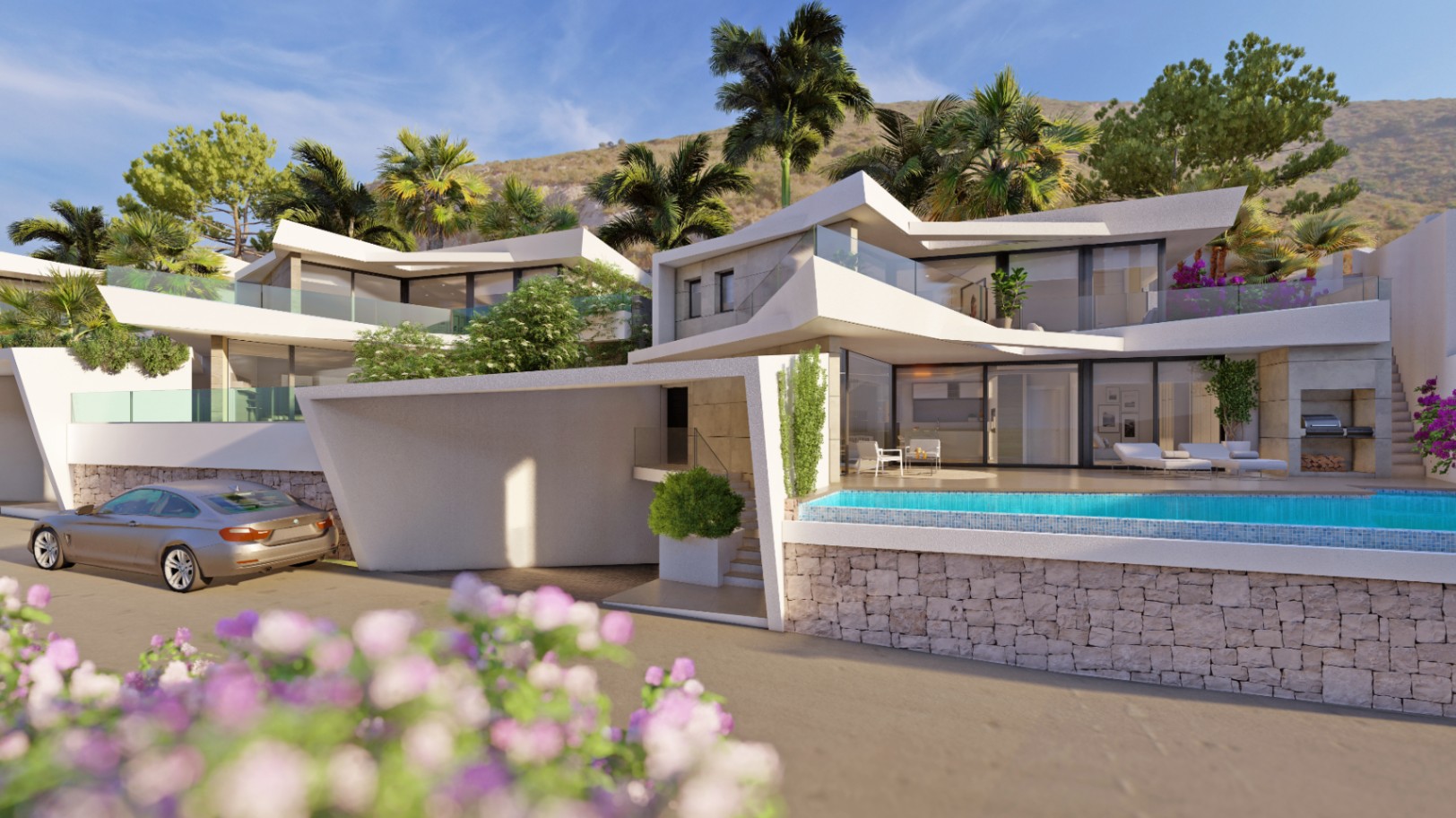 Moderne mehrstöckige Villa mit markanter weißer Architektur, Infinity-Pool über Natursteinmauern und Glasbalkonen vor einer Hügellandschaft mit Palmen.