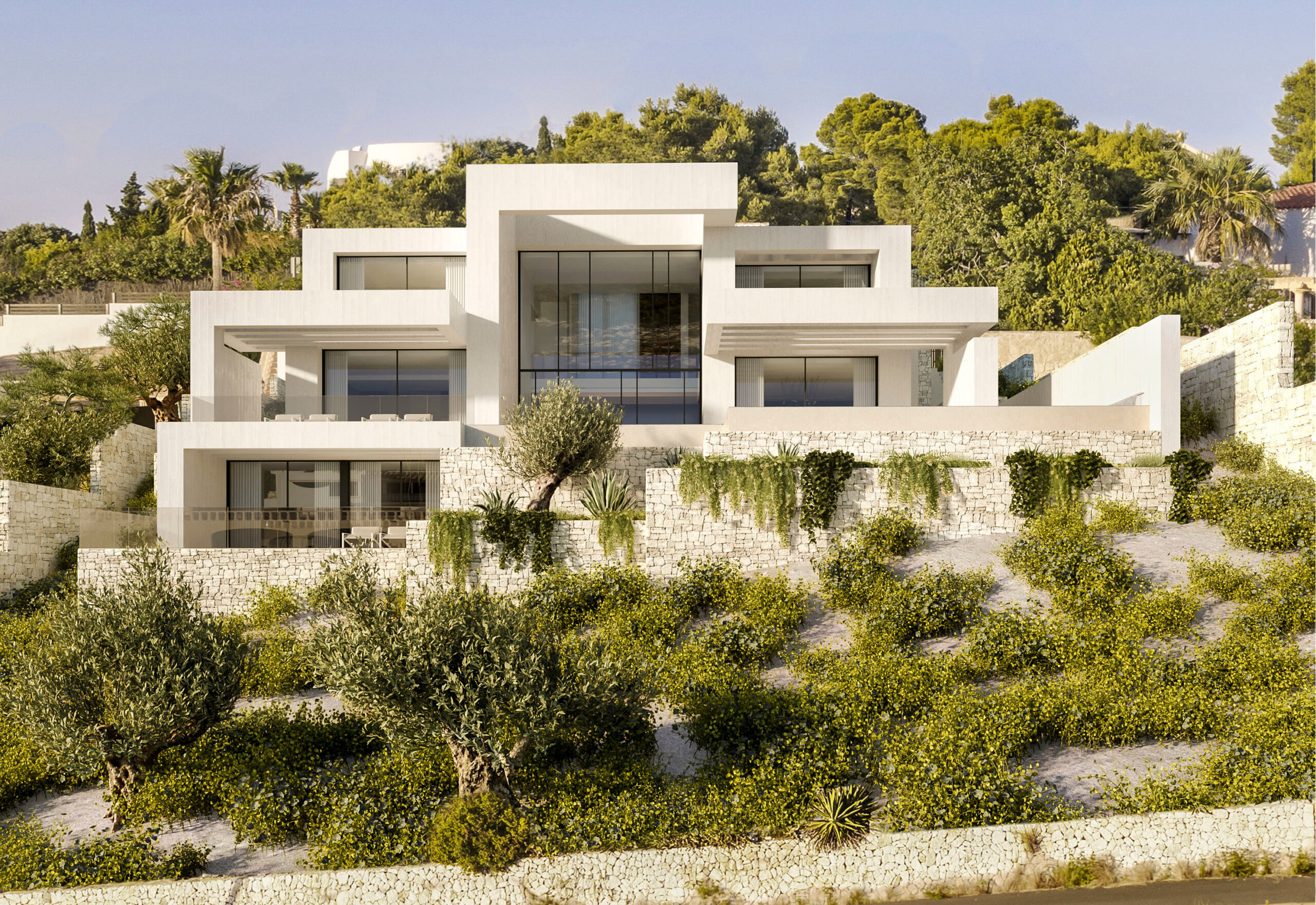 Moderne mehrstöckige Außenfassade mit weißen geometrischen Formen, Natursteinmauern und bodentiefen Glasfronten in mediterraner Hanglage.