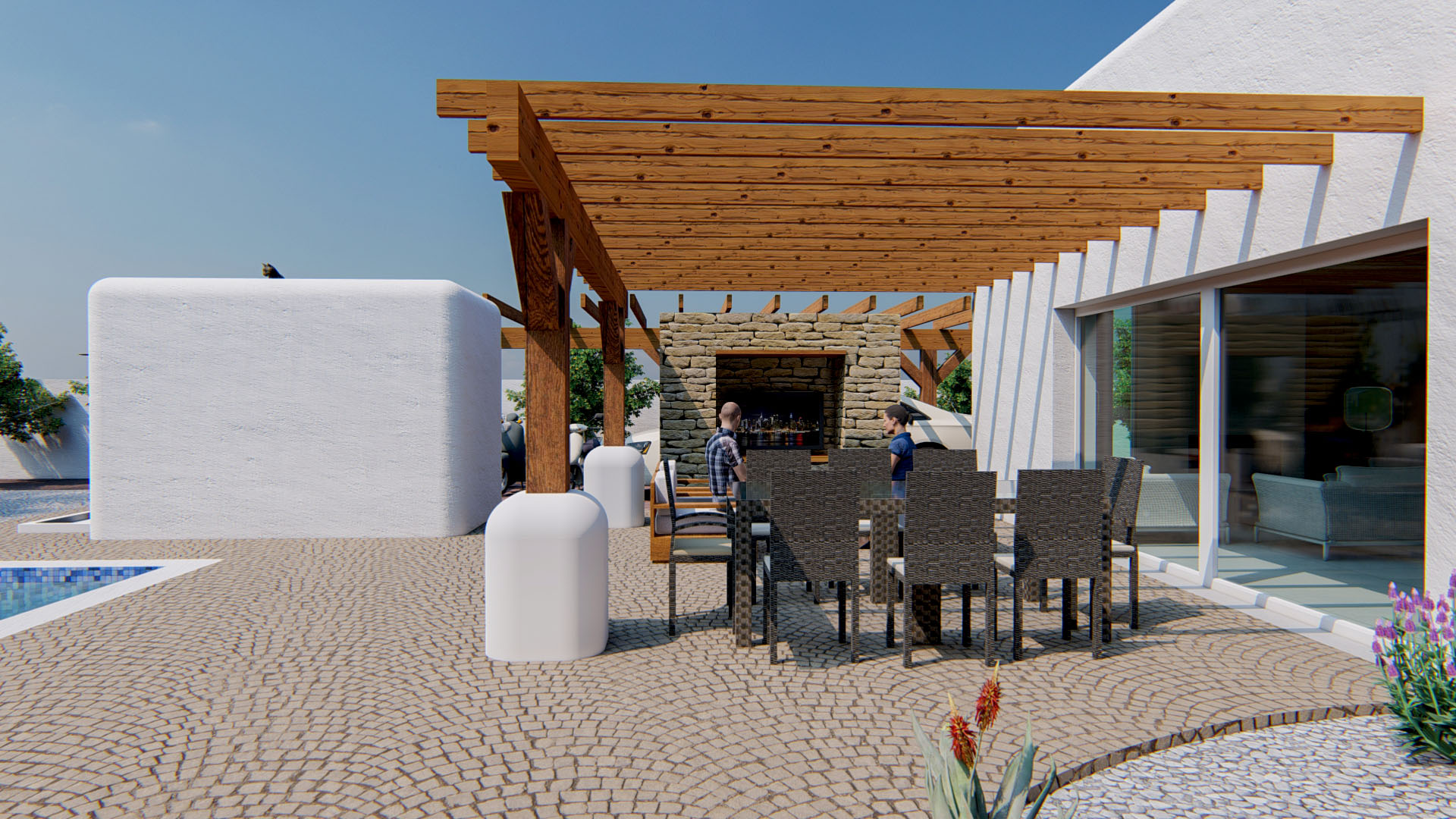Außen-Essbereich unter einer Holzpergola mit Natursteinwand, integriertem Kamin und Kopfsteinpflaster-Terrasse direkt neben dem Pool.