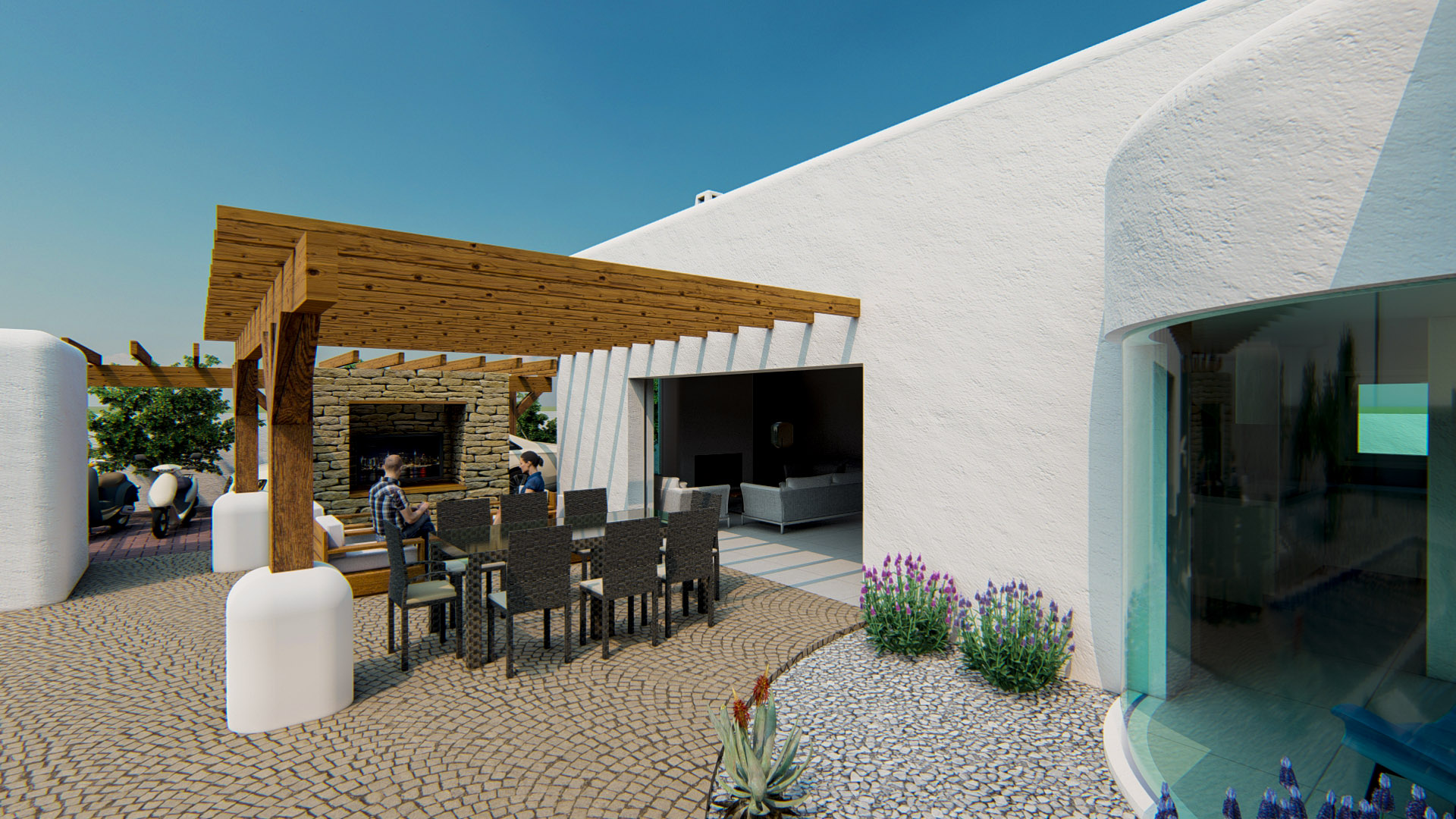 Außen-Terrasse mit Holzpergola, Essbereich auf Kopfsteinpflaster und direktem Zugang zum Wohnzimmer durch eine große Schiebetür.