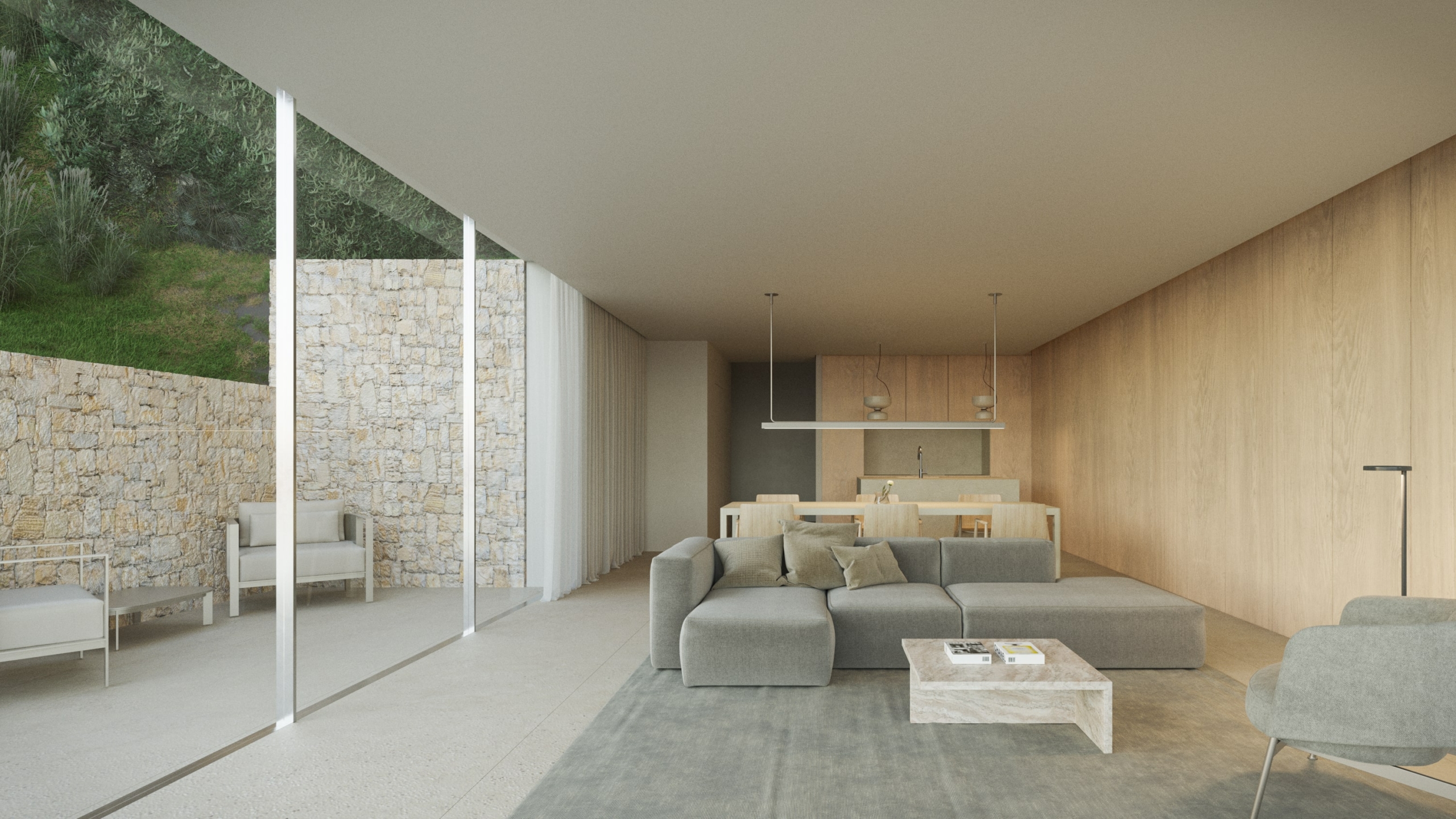 Offener Wohnbereich mit grauem Ecksofa, Holzvertäfelung und raumhohen Glasfronten, die auf eine Terrasse mit Natursteinmauer führen.