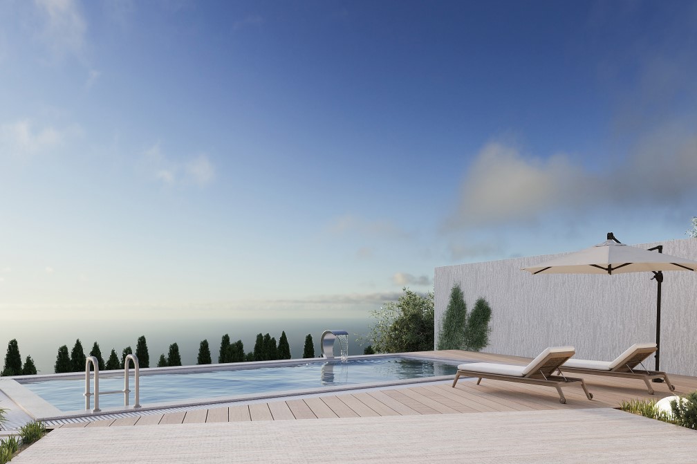 Blick auf den privaten Pool mit Wasserfall und Sonnenliegen, umgeben von Grün und Meerblick.