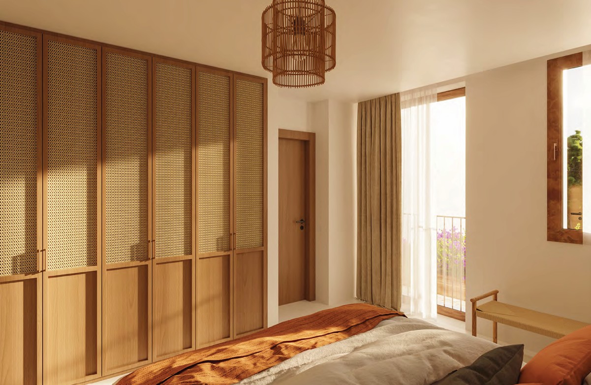 Schlafzimmer mit Holzschrank und Hängelampe aus Korbweide.