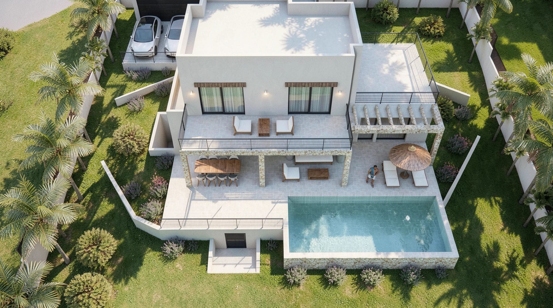 Luftaufnahme der modernen Villa mit rechteckigem Pool, zweistöckigen Terrassen mit Natursteinakzenten und mediterranem Garten mit Palmen.