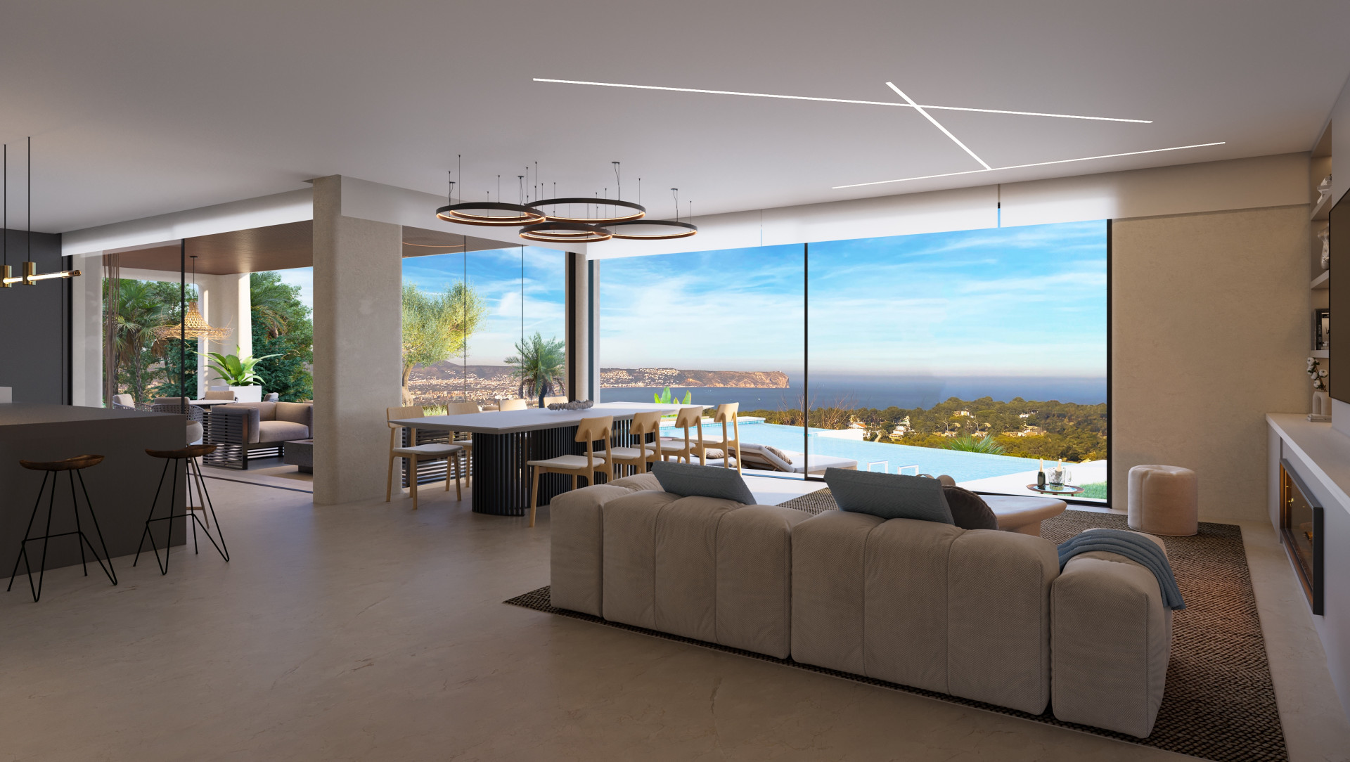 Geräumiges Wohnzimmer mit Panoramablick auf das Meer, offene Küche und moderne Möbel in Jávea.