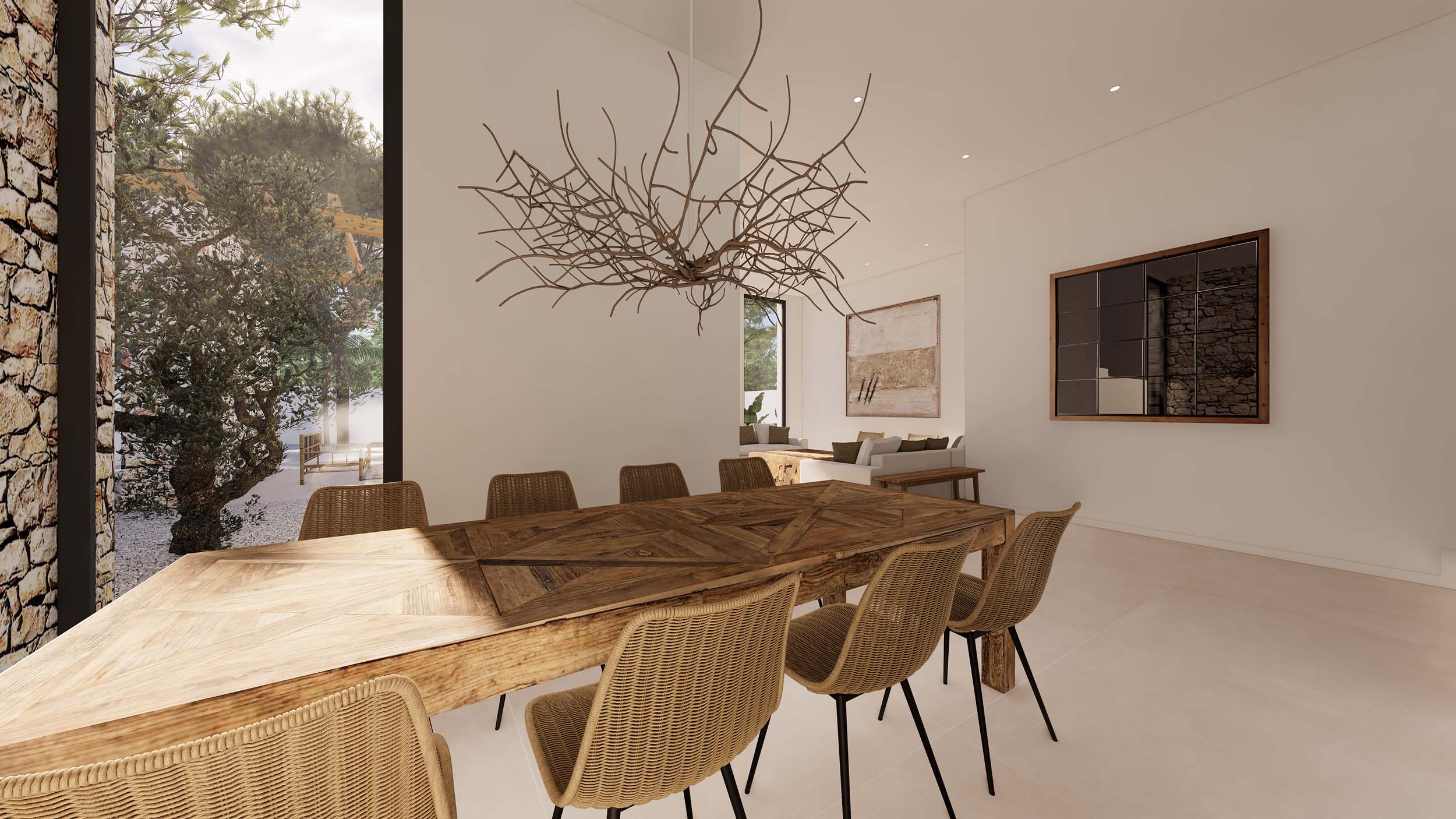 Essbereich im Ibiza-Stil mit rustikalem Holztisch und Korbstühlen. Ein skulpturaler Ast-Kronleuchter und bodentiefe Fenster mit Blick auf den Garten und die Natursteinmauer prägen den Raum.