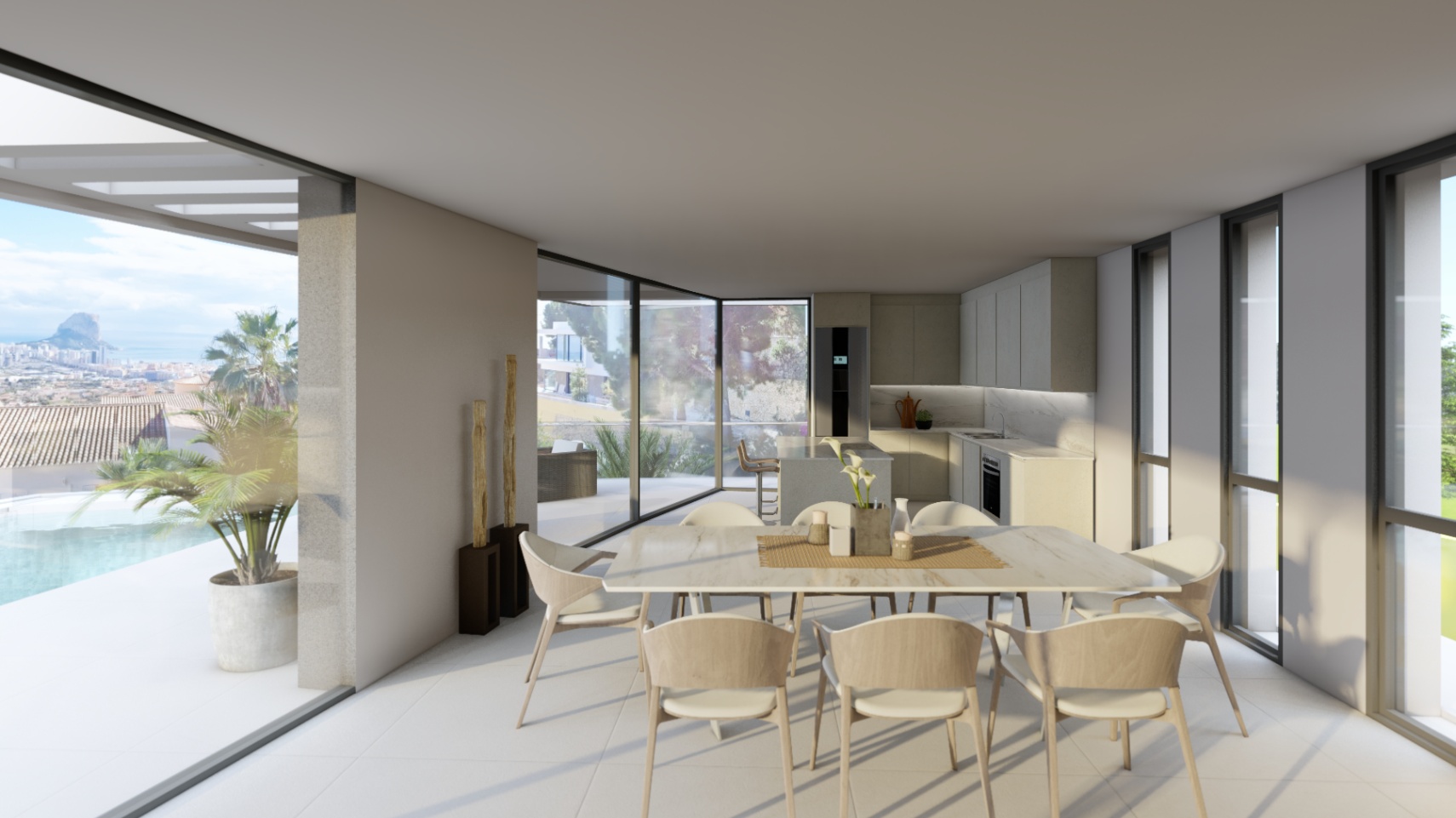 Offener Essbereich mit moderner Einbauküche und bodentiefen Fenstern, die den Blick auf die Terrasse, den Infinity-Pool und den Peñón de Ifach öffnen.