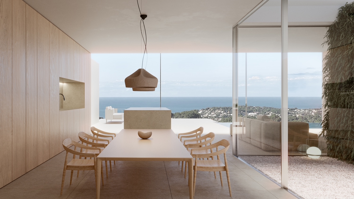 Minimalistischer Essbereich mit hellem Holztisch, Panoramablick auf das Meer und moderner Pendelleuchte.