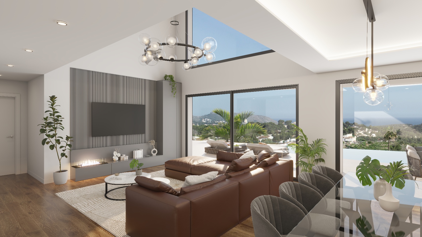 Offener Wohnbereich mit doppelter Deckenhöhe, integriertem Kamin an einer grauen Lamellenwand und großen Glasfronten mit Blick auf das Meer und die Berge.