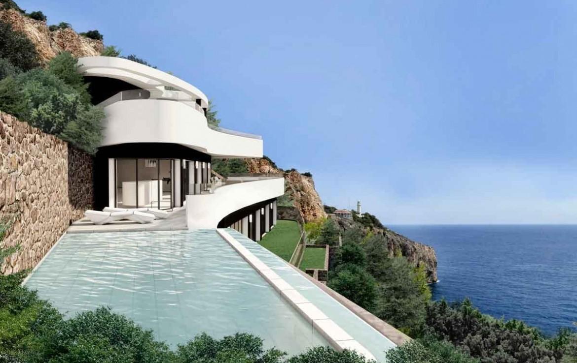 Minimalistische Fassade mit geschwungenen weißen Terrassen und Infinity-Pool. Die Architektur kombiniert Natursteinwände mit weitem Blick auf das Mittelmeer und die Steilküste.