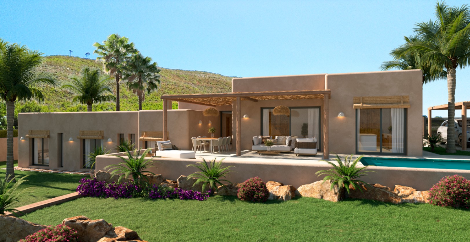 Außenansicht der Villa mit erdfarbener Fassade, Holzpergola-Terrasse, Lounge-Bereich und Pool, umgeben von einem mediterranen Garten mit Palmen und Felsenelementen.