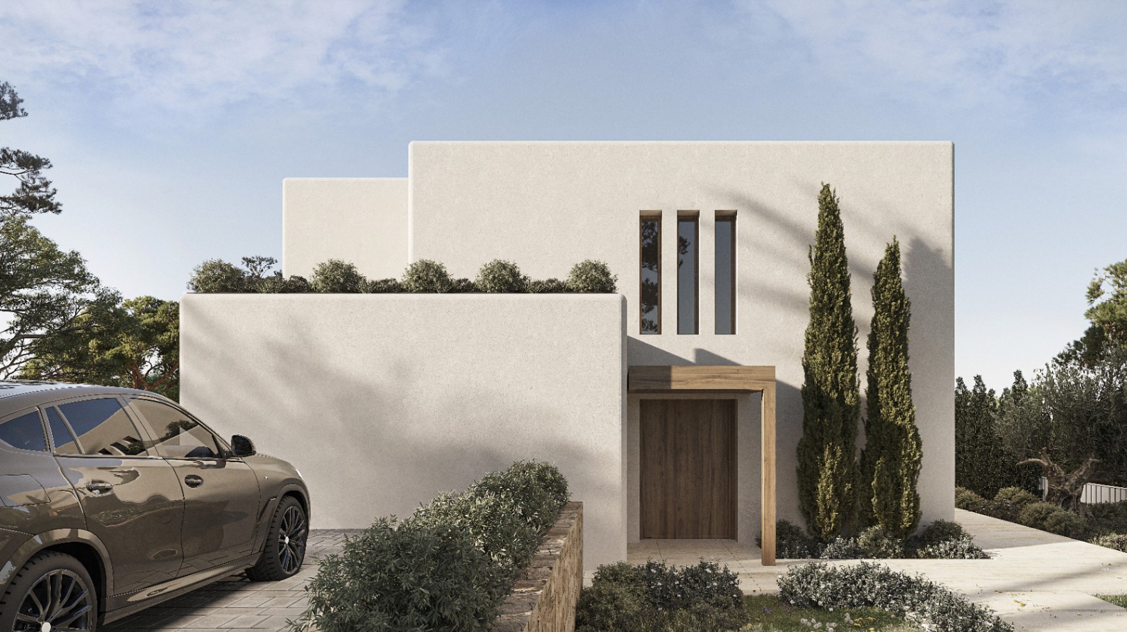 Moderne Villenfassade in Benissa mit Holztür und gepflegtem Grün.