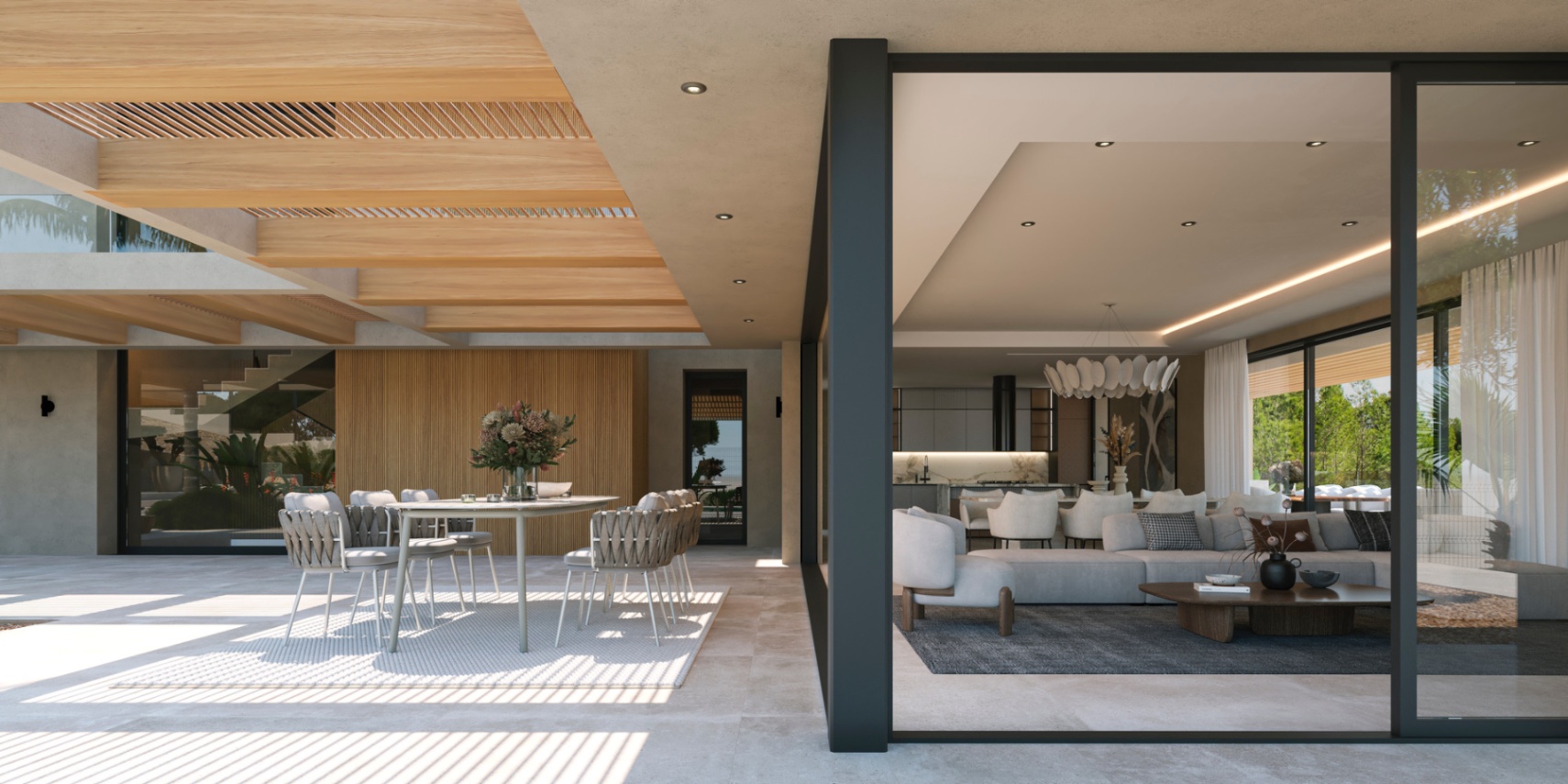 Außen-Terrasse mit Holzpergola und Essbereich, die durch bodentiefe Glasschiebetüren nahtlos in den offenen Wohn- und Küchenbereich übergeht.
