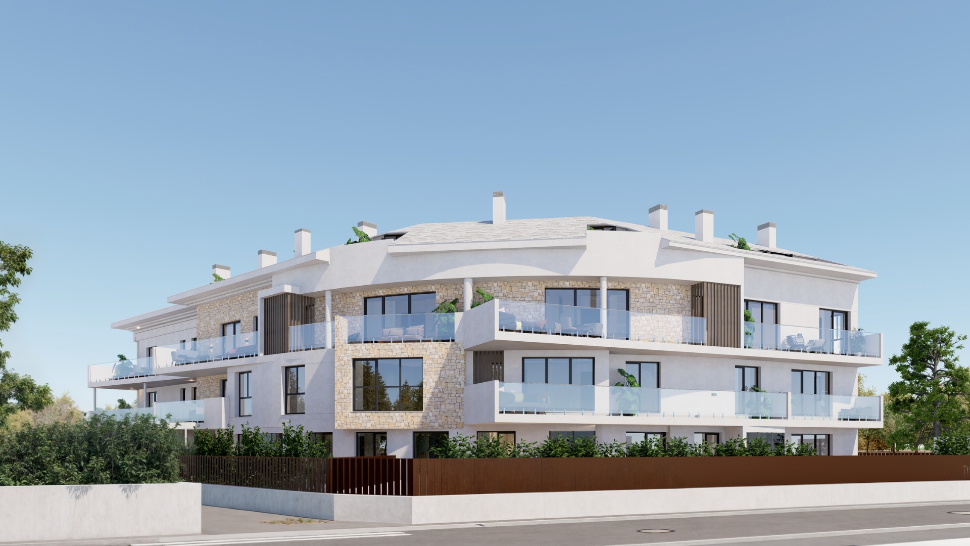 Außenansicht des dreistöckigen Gebäudes mit weißer Fassade, Natursteinakzenten, geschwungenen Glasterrassen und dunklen Fensterrahmen.